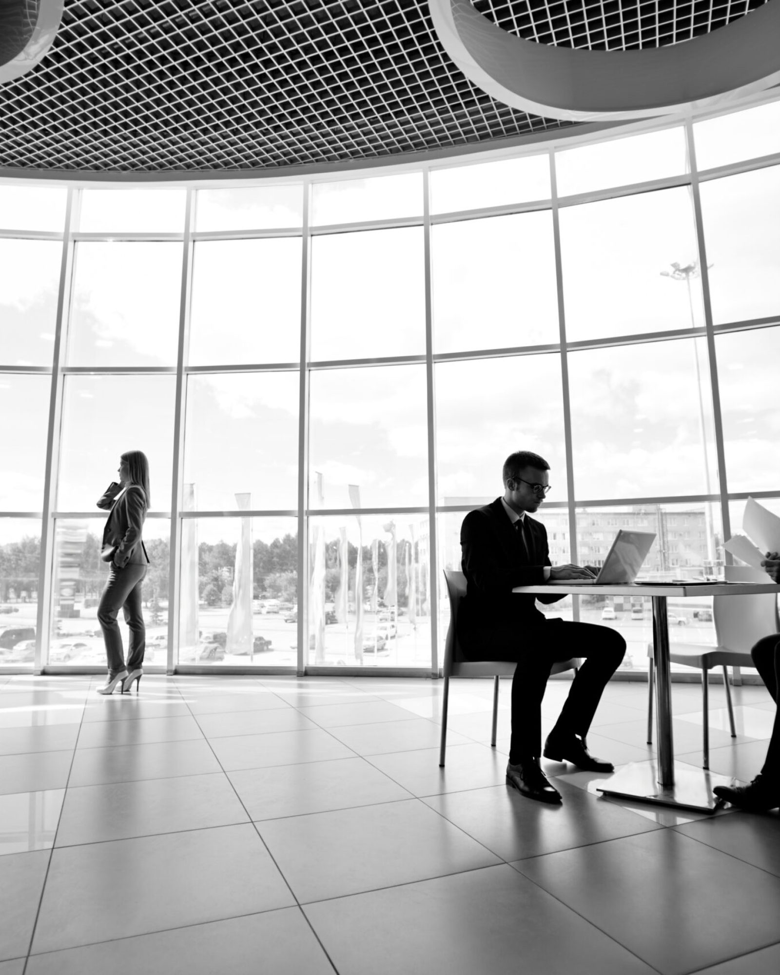 Two businessmen and businesswoman working in office